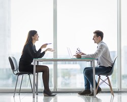 Male and female in discussion during  meeting